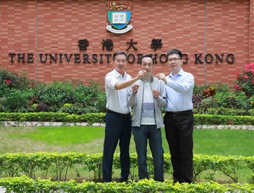 Dr Tony Shien-Ping Feng (left) and Dr Wen-Di Li (right) of the Department of Mechanical Engineering, and Mr Kent Chung, Flectrode’s investor, holding a piece of prototype metal-mesh transparent electrode manufactured through the process developed at HKU