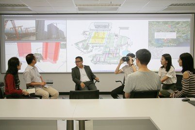 Dr Wilson Lu (third from left) and his team discussing the digital construction platform