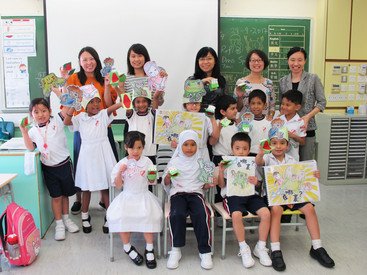 Multicultural students meeting the authors (local teachers) of their tailor-made picture book which combines theory and pedagogy