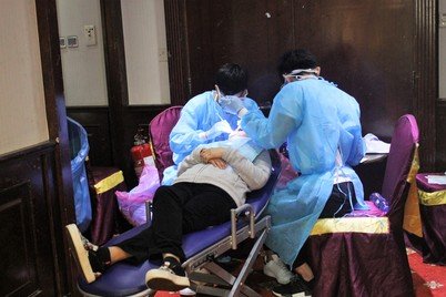 Volunteers and graduates of the Faculty of Dentistry providing dental check-up and demonstrating brushing techniques at the Fair