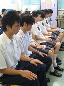 Students practicing meditation to enhance their abilities to cope with stress