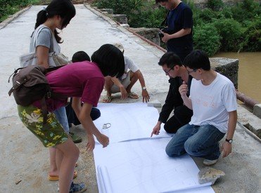 Mr John Lin (second right) working with students at Taiping Bridge in Guizhou