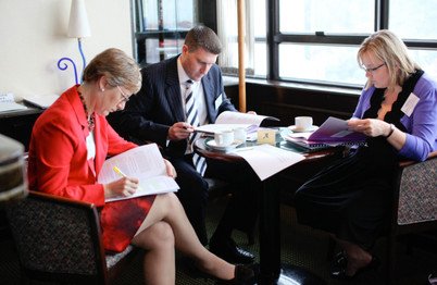 Executives reading ACRC case studies at the HSBC McKinsey Business Case Competition 2011